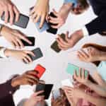 group of people holding smartphones using data collection apps