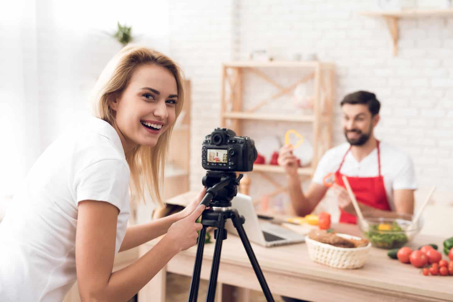 man and woman recording a cooking video