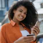 woman saving money using smartphone app